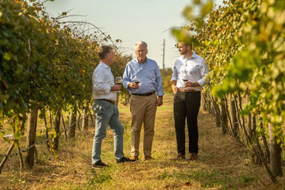 Founder Gary Cox, his son Charles Cox, and grandson Christian Slupe